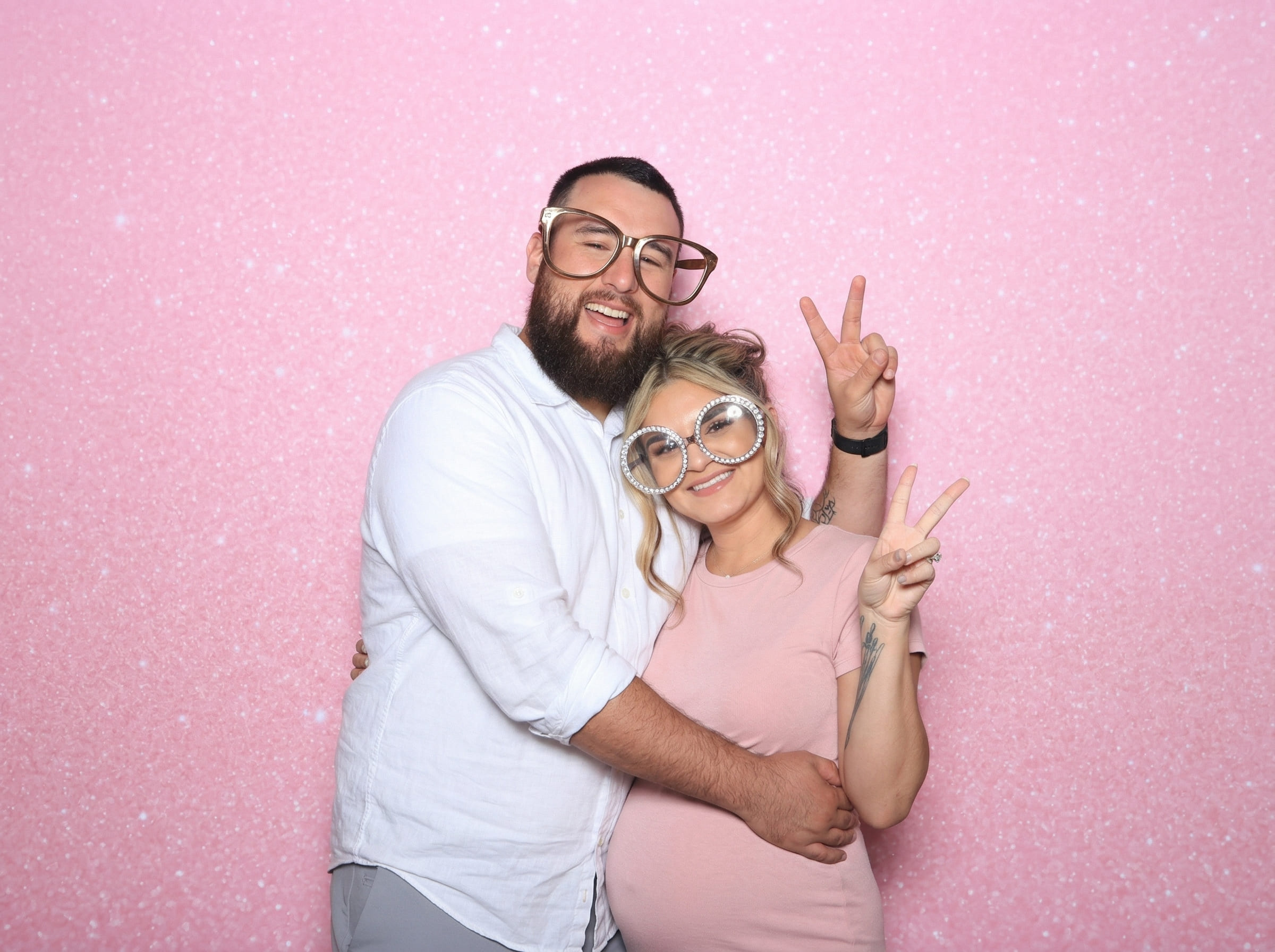 Guests enjoying the photo booth at a Calgary baby shower